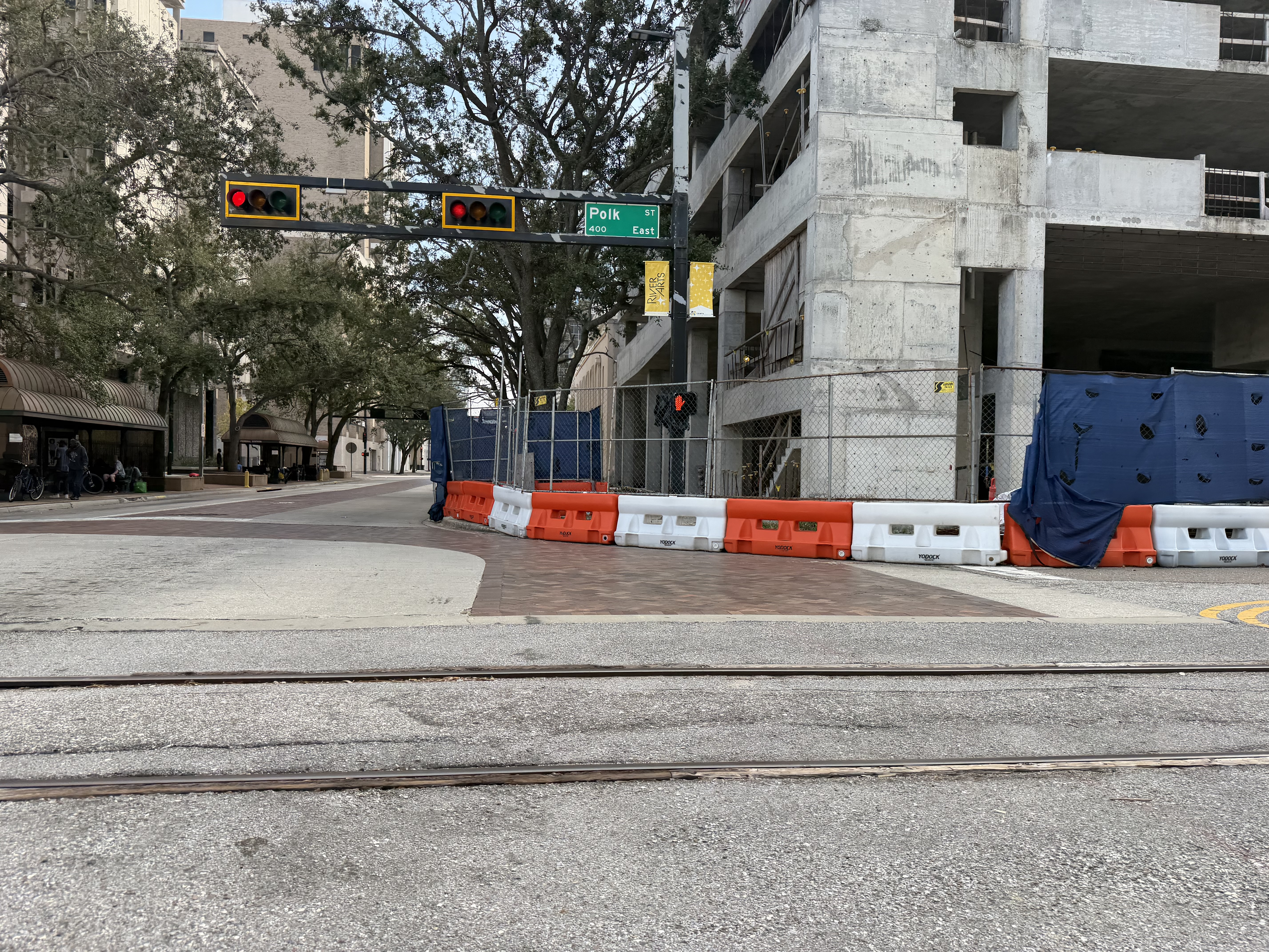 Signalized intersection at Polk Street with rail tracks and traffic signals